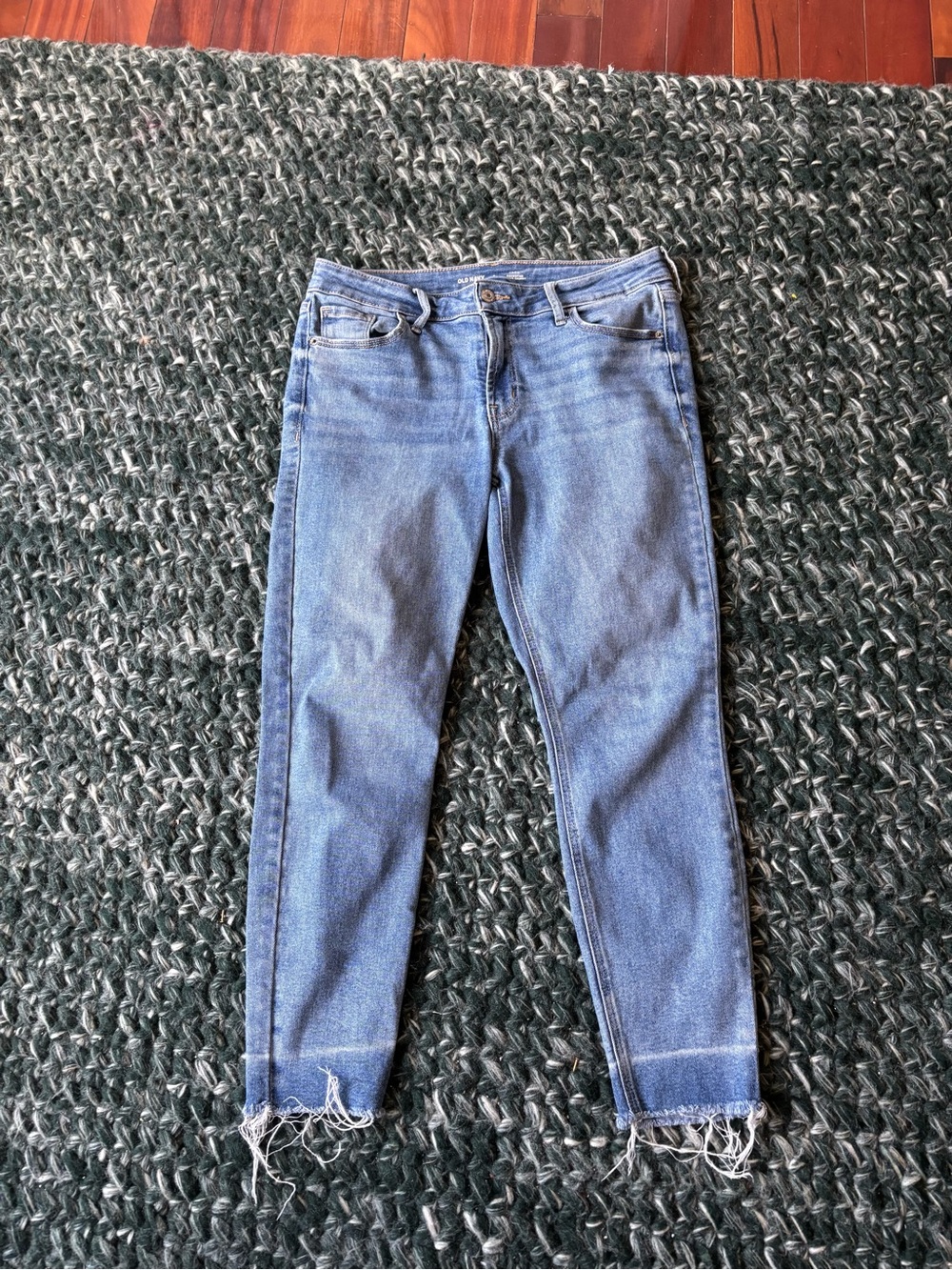 old navy mid rise rockstar super skinny jeans with raw hem